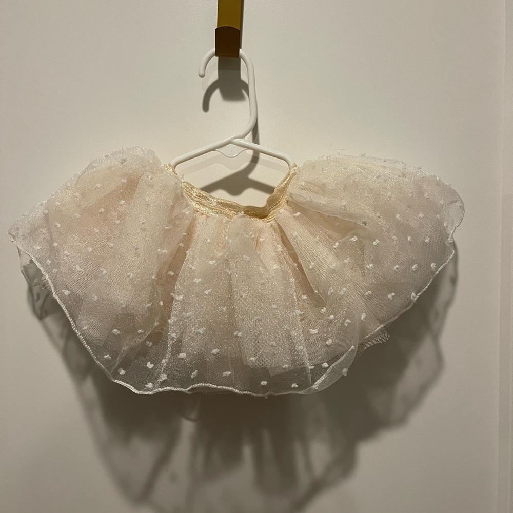 Baby girls to two. Size 0 to 12 months. off white with pika dots